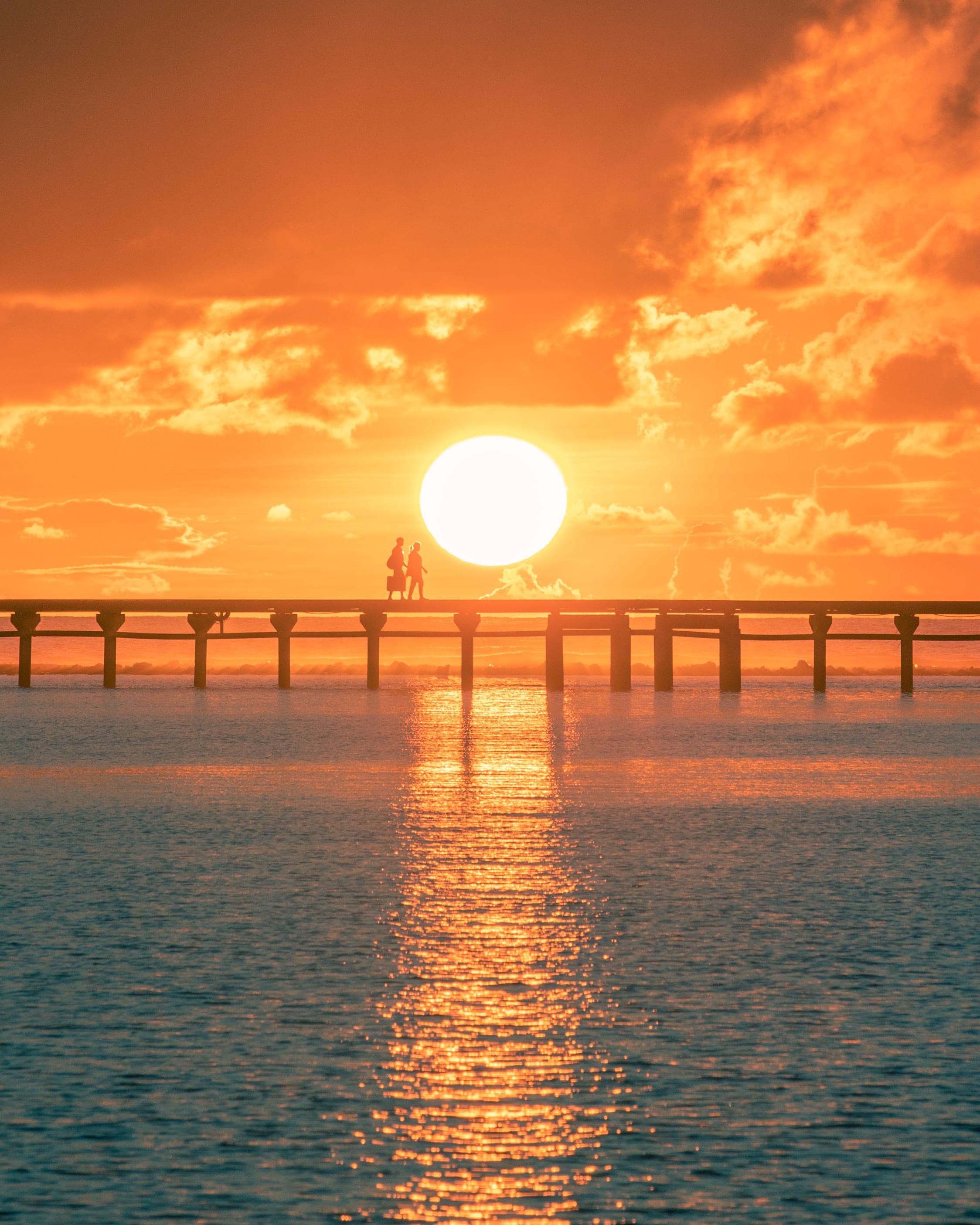 Sunrise Couple Walking Water Bridge