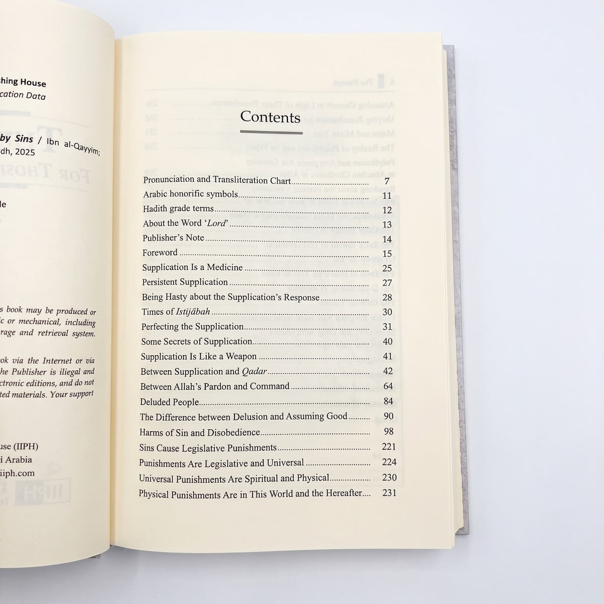 An open book showing the printed Contents page with a list of chapters and page numbers on cream paper, photographed against a plain white background.
