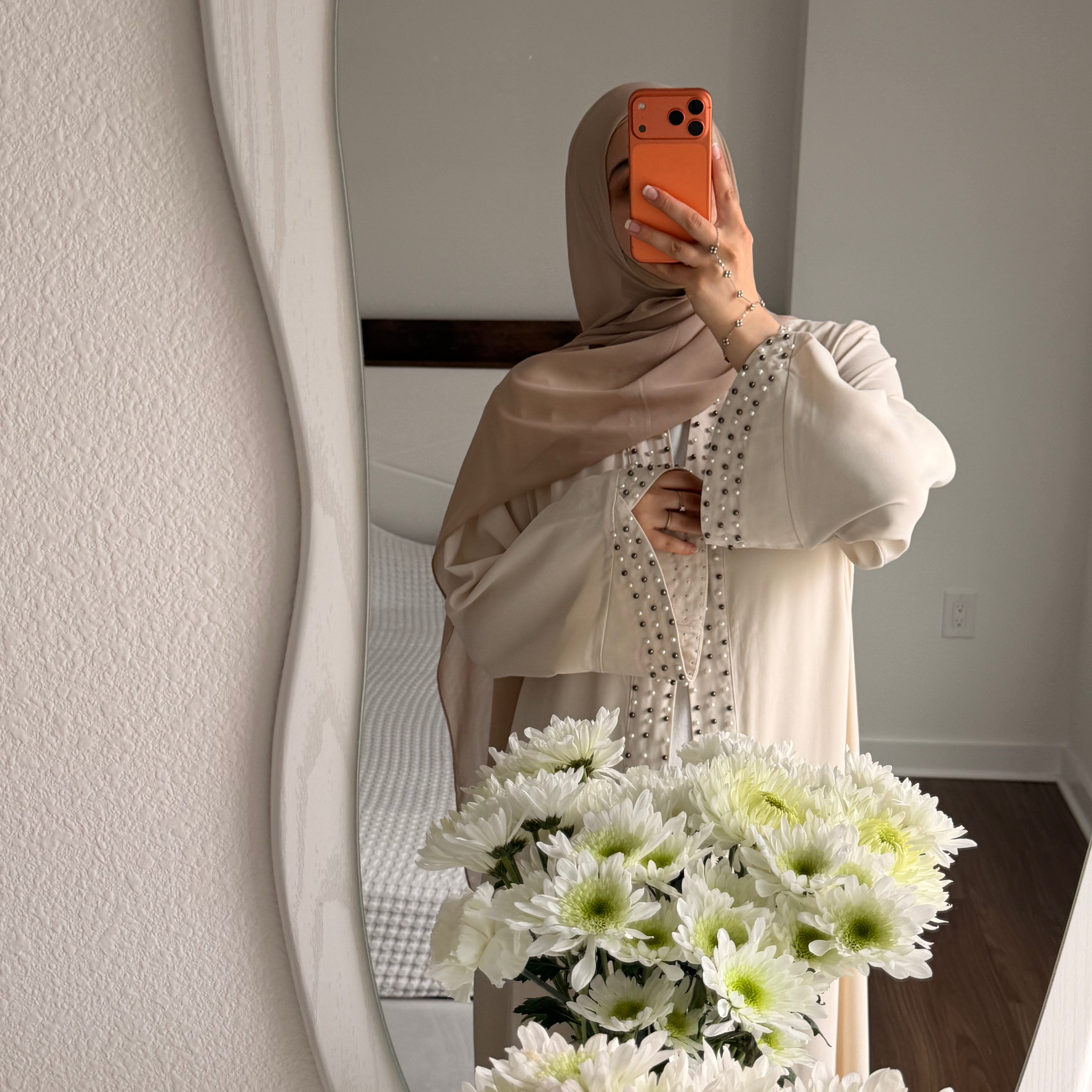 cute hijab wearing girl wearing amirah abaya in cream with flowers and jewellery