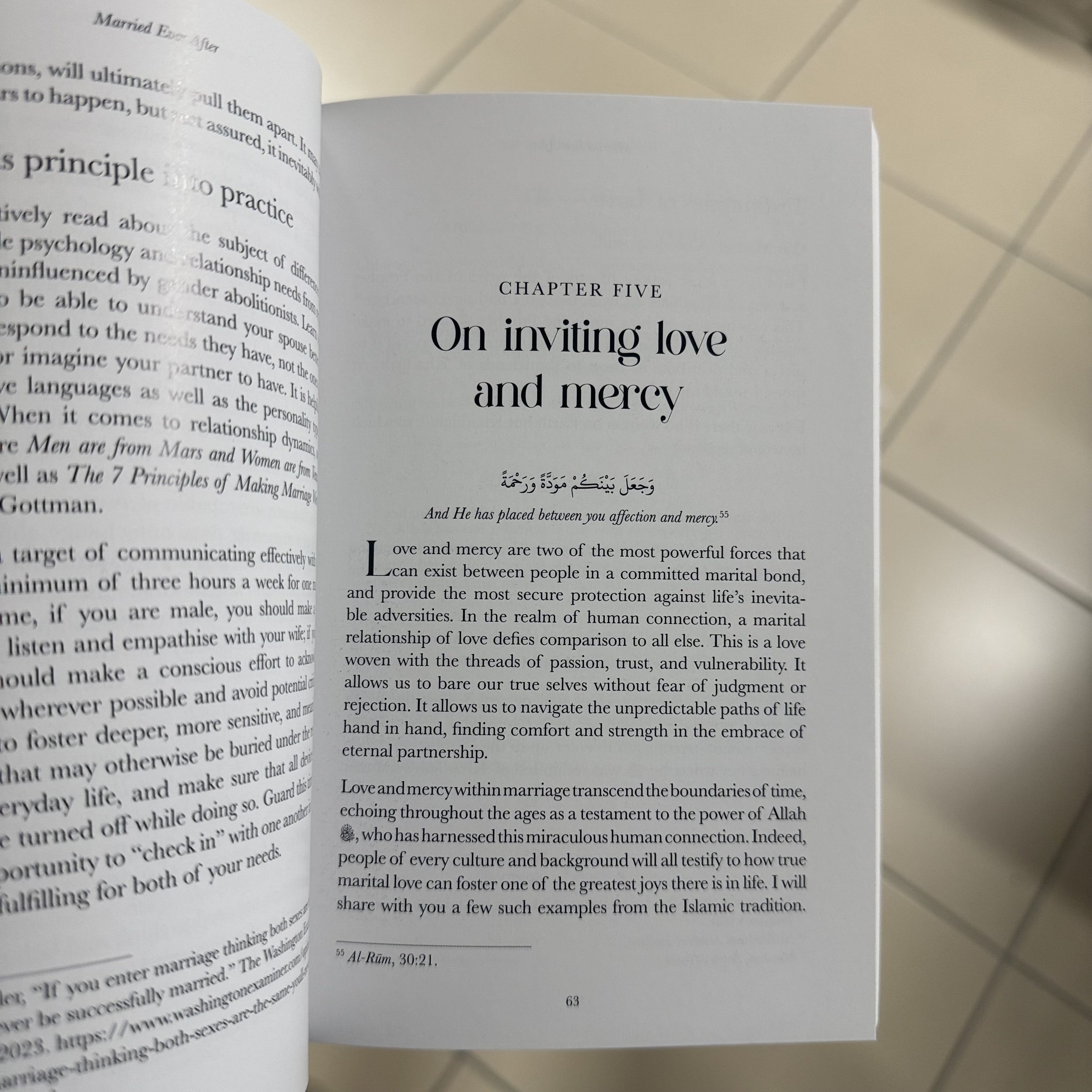 Open book with text on inviting love and mercy on a tiled floor background