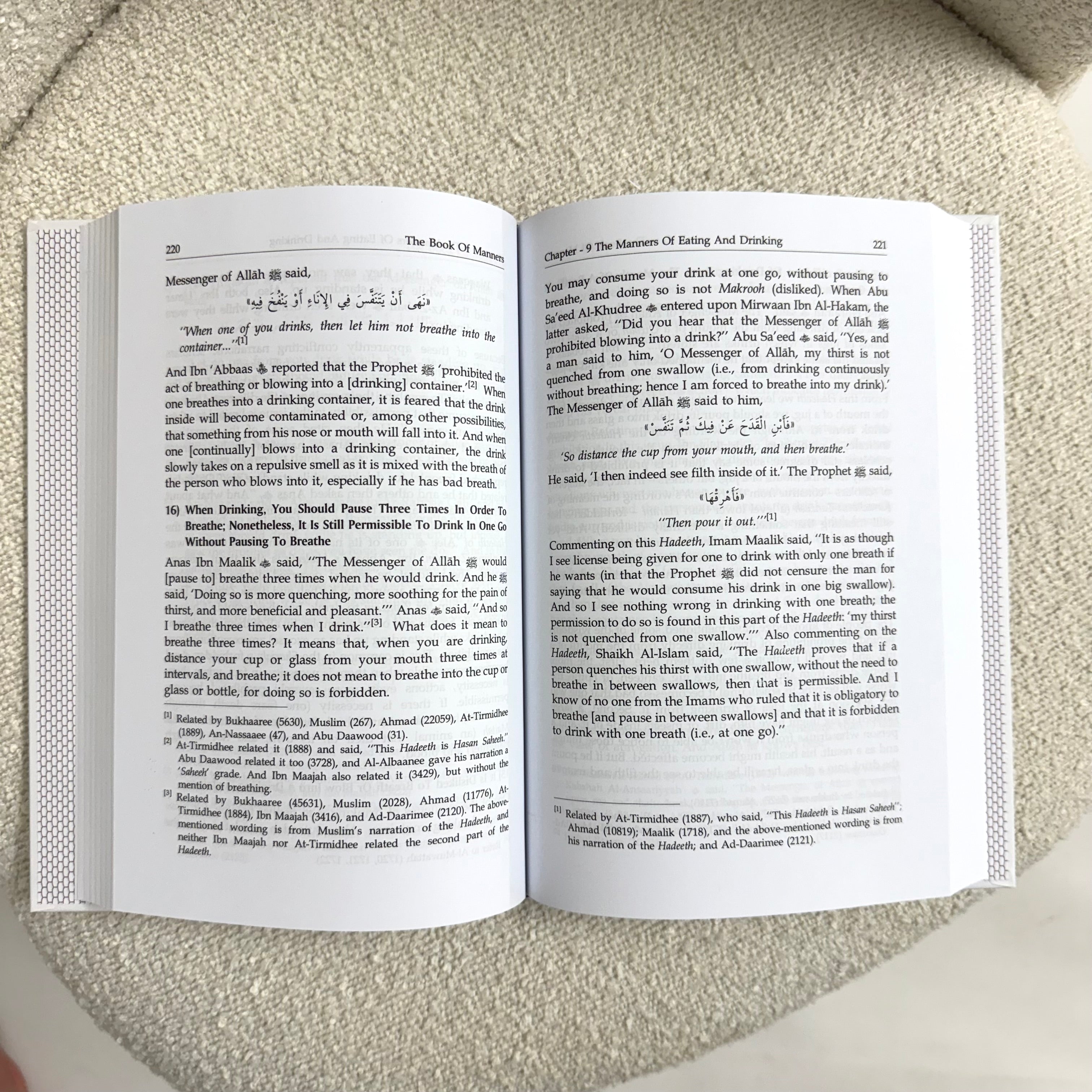 Open book with text on a textured surface
