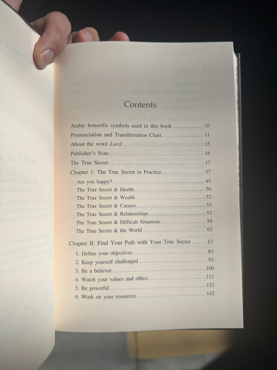Open book showing a table of contents with a dark background