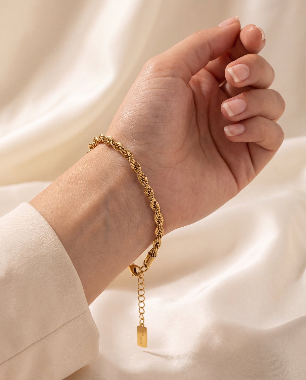 gold rope chain bracelet on arm
