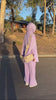 Woman wearing the Fajr Noor Sarah Set in violet with a matching lavender premium jersey hijab, styled outdoors with a beige crossbody bag for a modest everyday hijabi look.