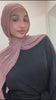 Woman wearing the Fajr Noor Sarah Set in black, a belted tunic top with wide sleeves, styled with a dusty pink pashmina hijab for a modest hijabi outfit.