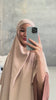 Woman wearing the Fajr Noor Khatijah Abaya in brown with matching hijab, taking a mirror selfie