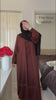 Woman wearing the Fajr Noor Aya Linen Abaya in coffee brown with a black hijab