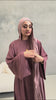 Woman wearing the Fajr Noor Khatijah Abaya in berry with a matching hijab in a studio setting