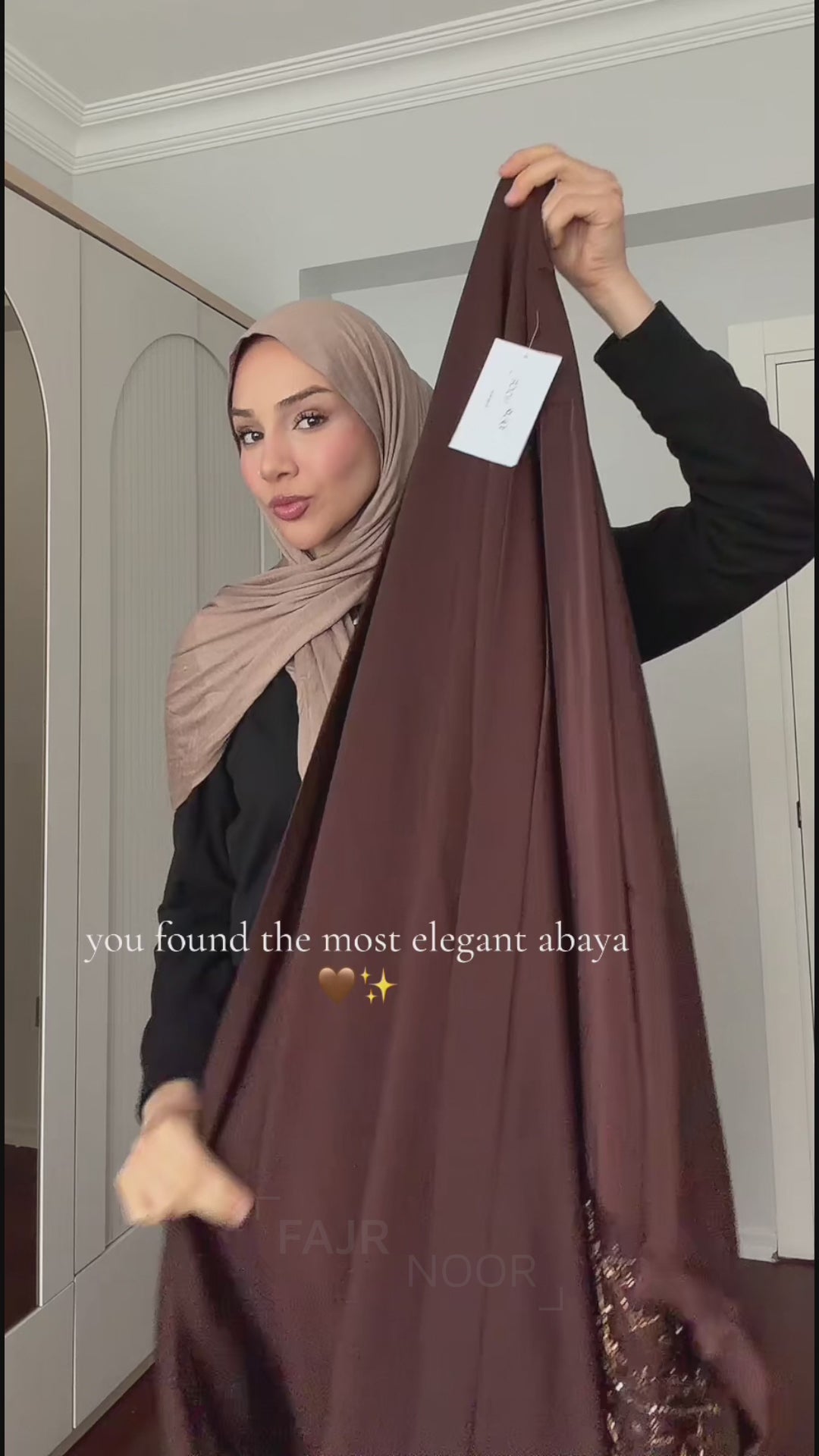 Woman wearing the Fajr Noor Maryam Abaya in coffee with embellished sleeves and a taupe hijab